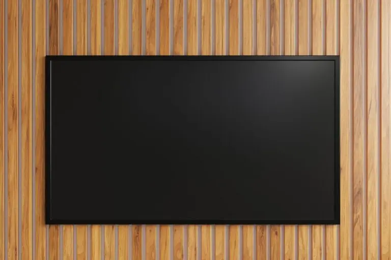 Wall-mounted television on a wood accent wall